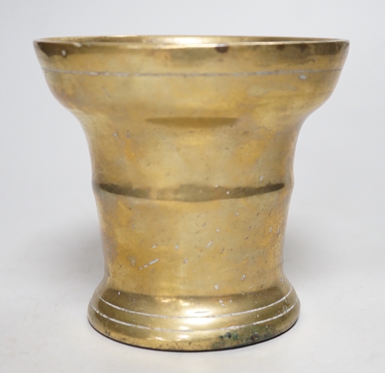 A 17th century bronze mortar. 12cm tall